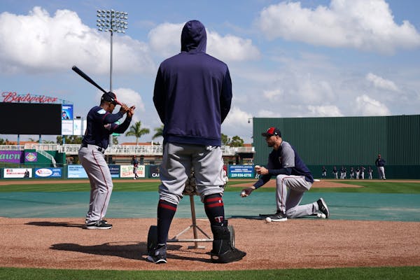 Twins third baseman Miguel Sano has a protective boot on his right leg to protect a cut he sustained in the offseason