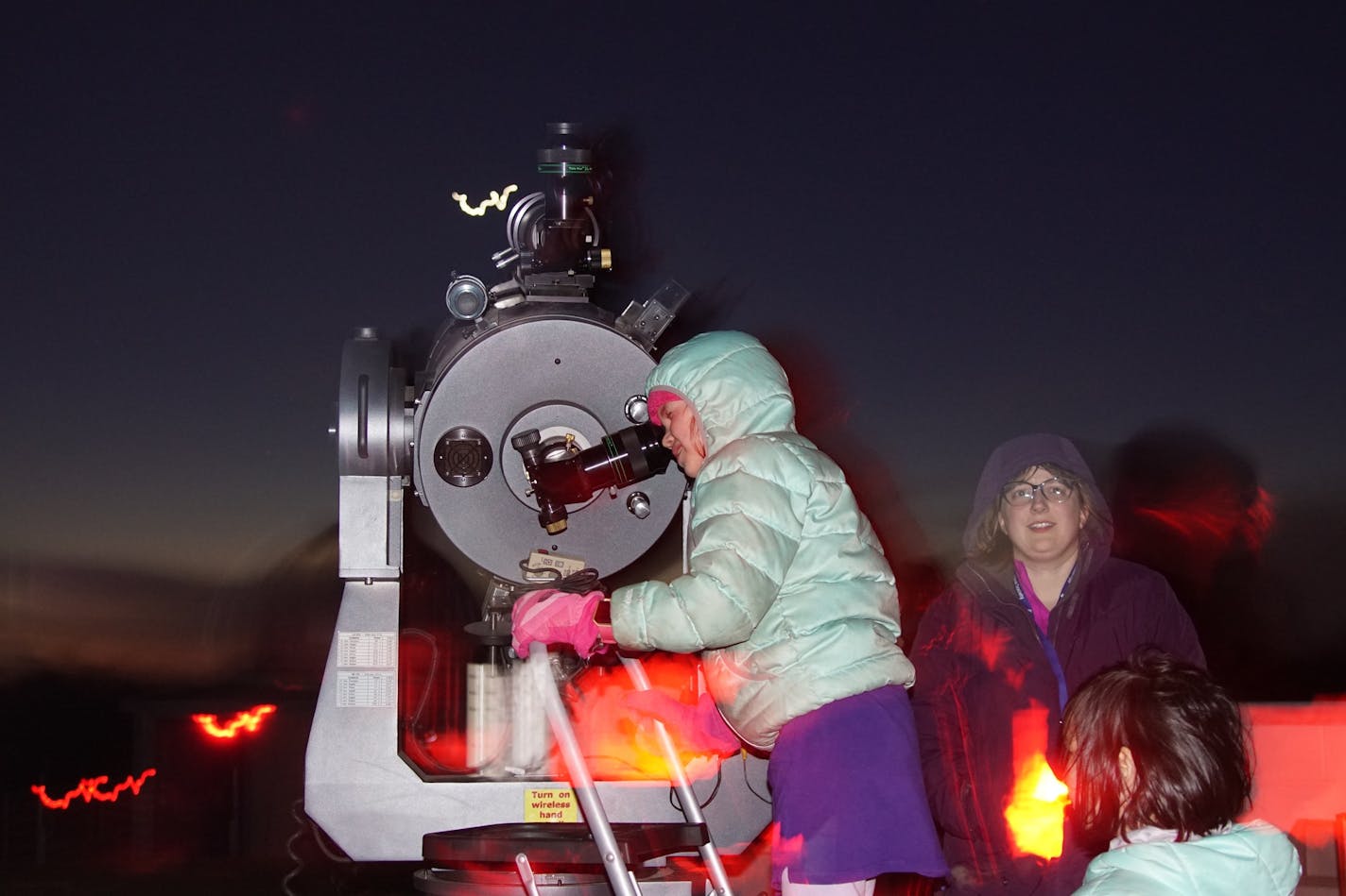 Kids waited to use telescopes at Eagle Lake&#x2019;s Onan Observatory.