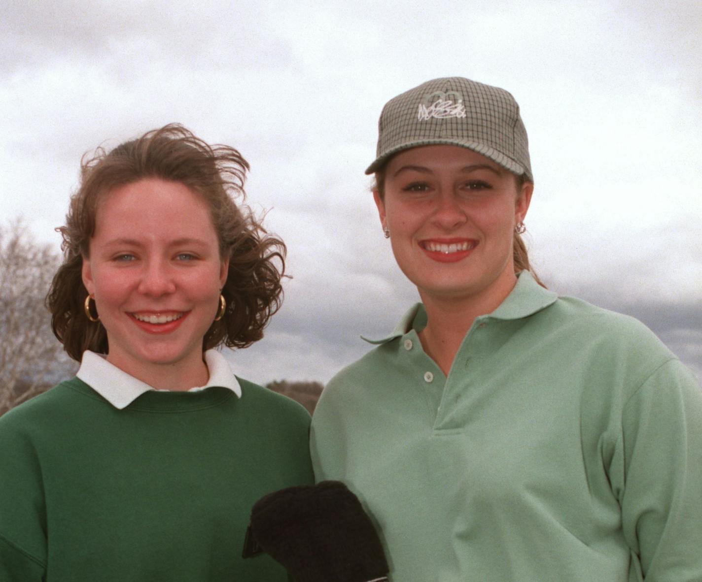 Edina juniors...Kalen Anderson, left and Hilary Homeyer...With Homeyer's club cover "Tweety Bird" ever watchful. Anderson finished second last year in the state tourney....Homeyer seventh.