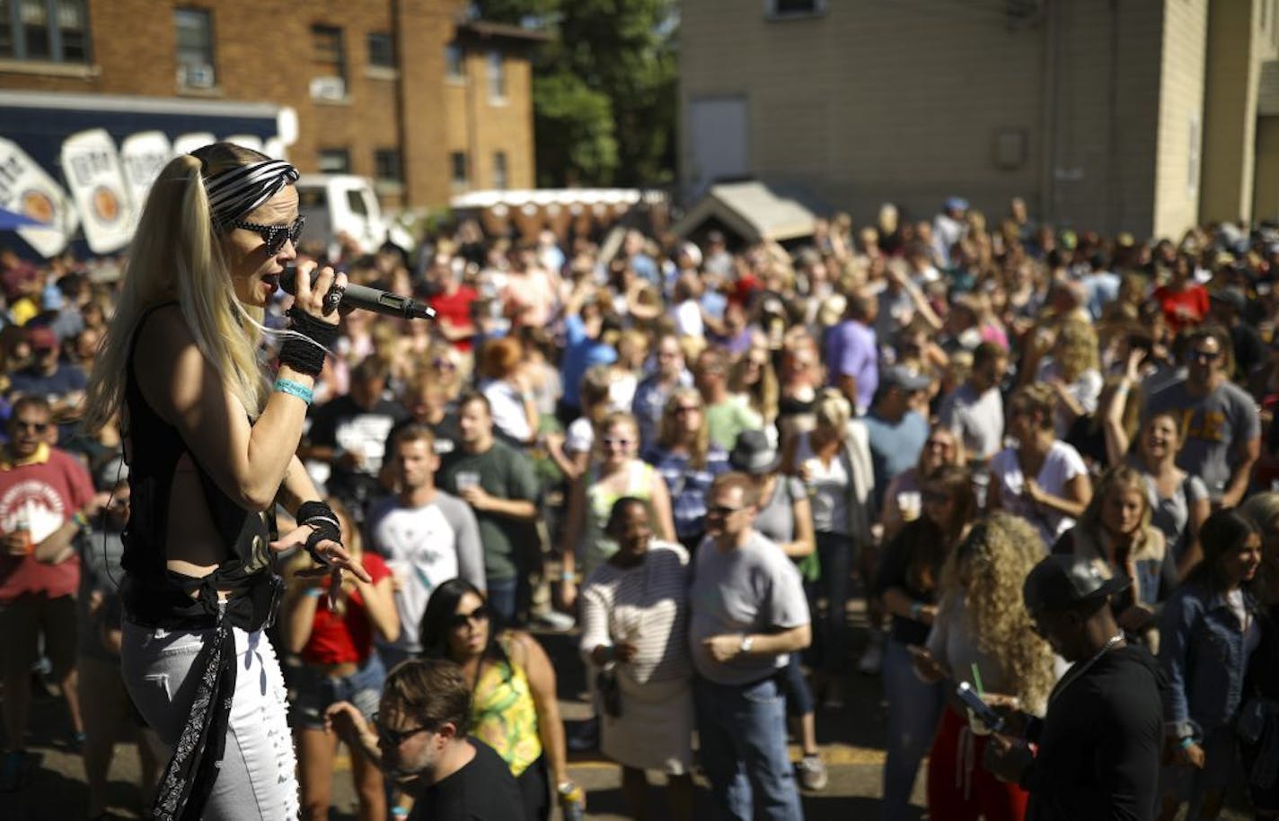 Jess Dording, the vocalist in Brat Pack Radio, sang as the band performed in the parking lot of Billy's on Grand in 2018.