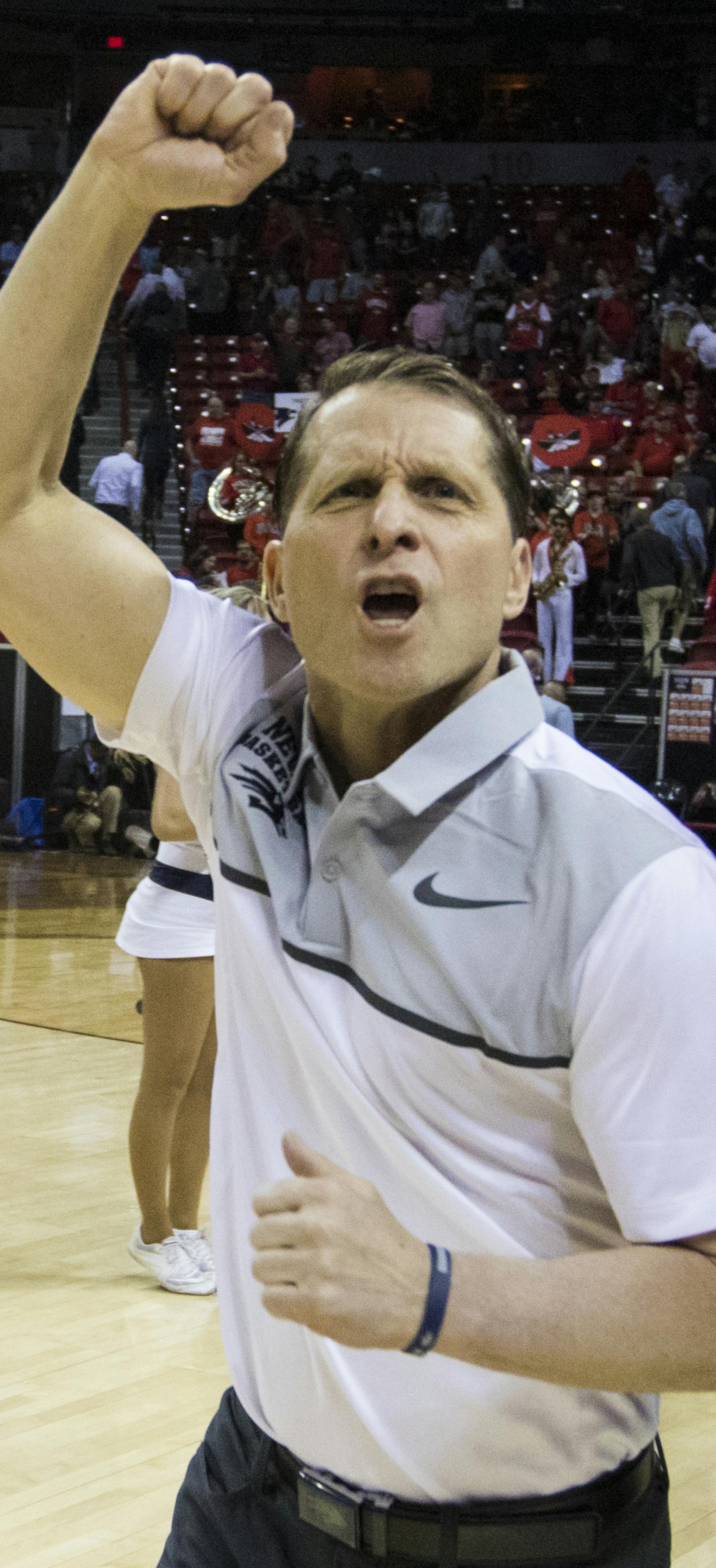 Nevada head coach Eric Musselman celebrates his teams win 79-74 over UNLV after the second half of an NCAA college basketball quarterfinals game in the Mountain West Conference tournament, Thursday, March 8, 2018, in Las Vegas. (AP Photo/L.E. Baskow)