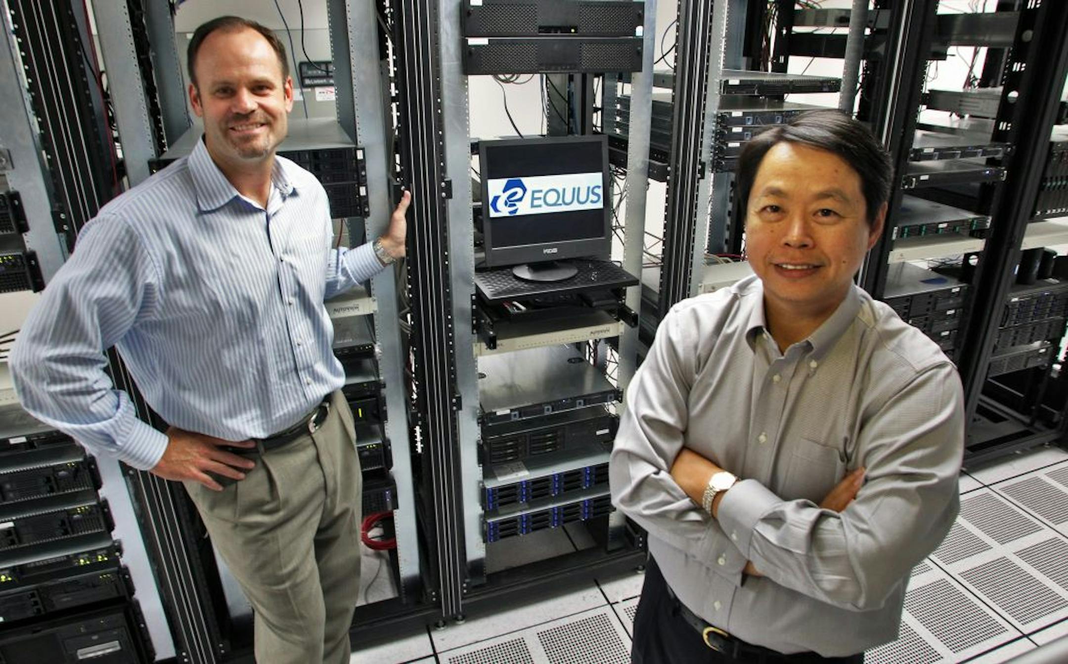 Officials of Equus computer server company based in Minnetonka. Jon Pollock, vice president of marketing and product management, left, and Andy Juang, CEO, in data equipment room of Equus Minnetonka headquarters. (MARLIN LEVISON/STARTRIBUNE(mlevison@startribune.com