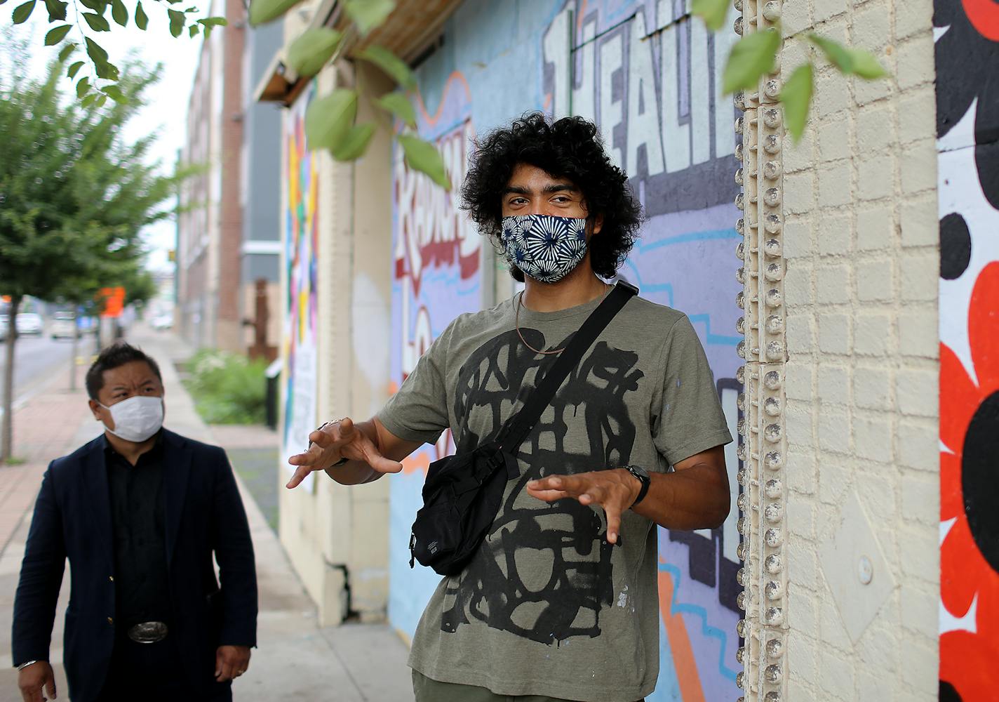 Artist Alex Smith, who painted murals on the boarded up Victoria Theater along University Ave. with Dai Thao, St. Paul city council member, left, during a tour of businesses along University Ave. effected during the recent unrest related to the death of George Floyd and seen Thursday, June 18, 2020, in St. Paul, MN.] DAVID JOLES • david.joles@startribune.com Of all the places in St. Paul that sustained damage during the height of the protests following George Floyd's killing, from an Ethiopian r