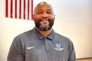 Khalid El-Amin has been named basketball coach at St. Thomas Academy.