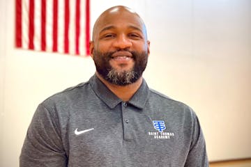 Khalid El-Amin has been named basketball coach at St. Thomas Academy.