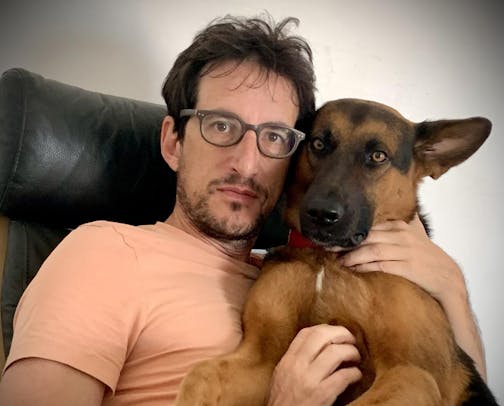 photo of author Mischa Berlinski and a dog