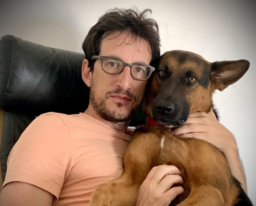 photo of author Mischa Berlinski and a dog