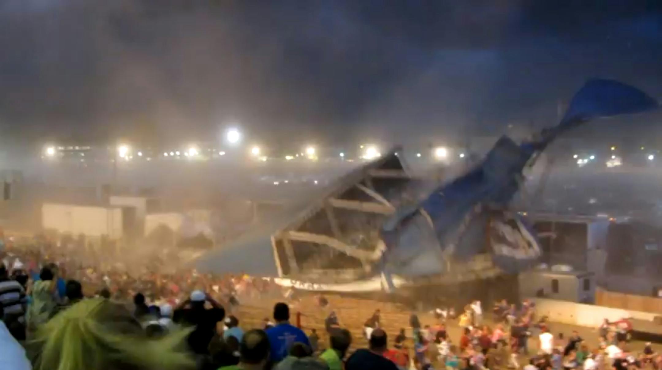 In this Saturday, Aug. 13, 2011 frame grab from video provided by Jessica Silas, a stage collapses at the Indiana State Fair, killing five and injuring dozens of fans waiting for the country band Sugarland to perform, in Indianapolis. (AP Photo/Jessica Silas)