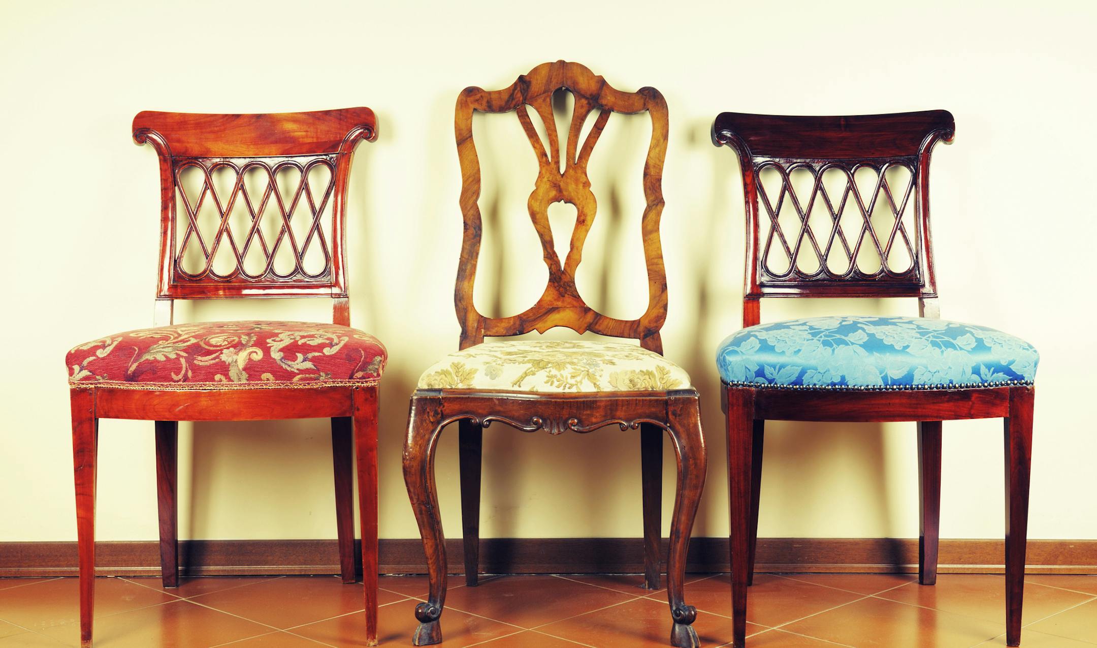 Three vintage chairs.Soft cross processing.istock