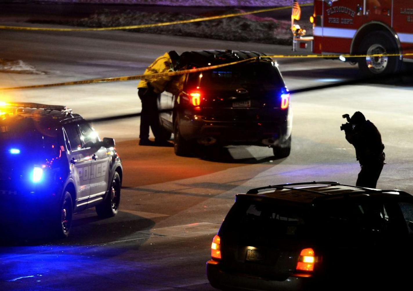 Plymouth police officers and firefighters blocked off and investigated the intersection of Northwest Boulevard and Rockford Road near where a body was lying.