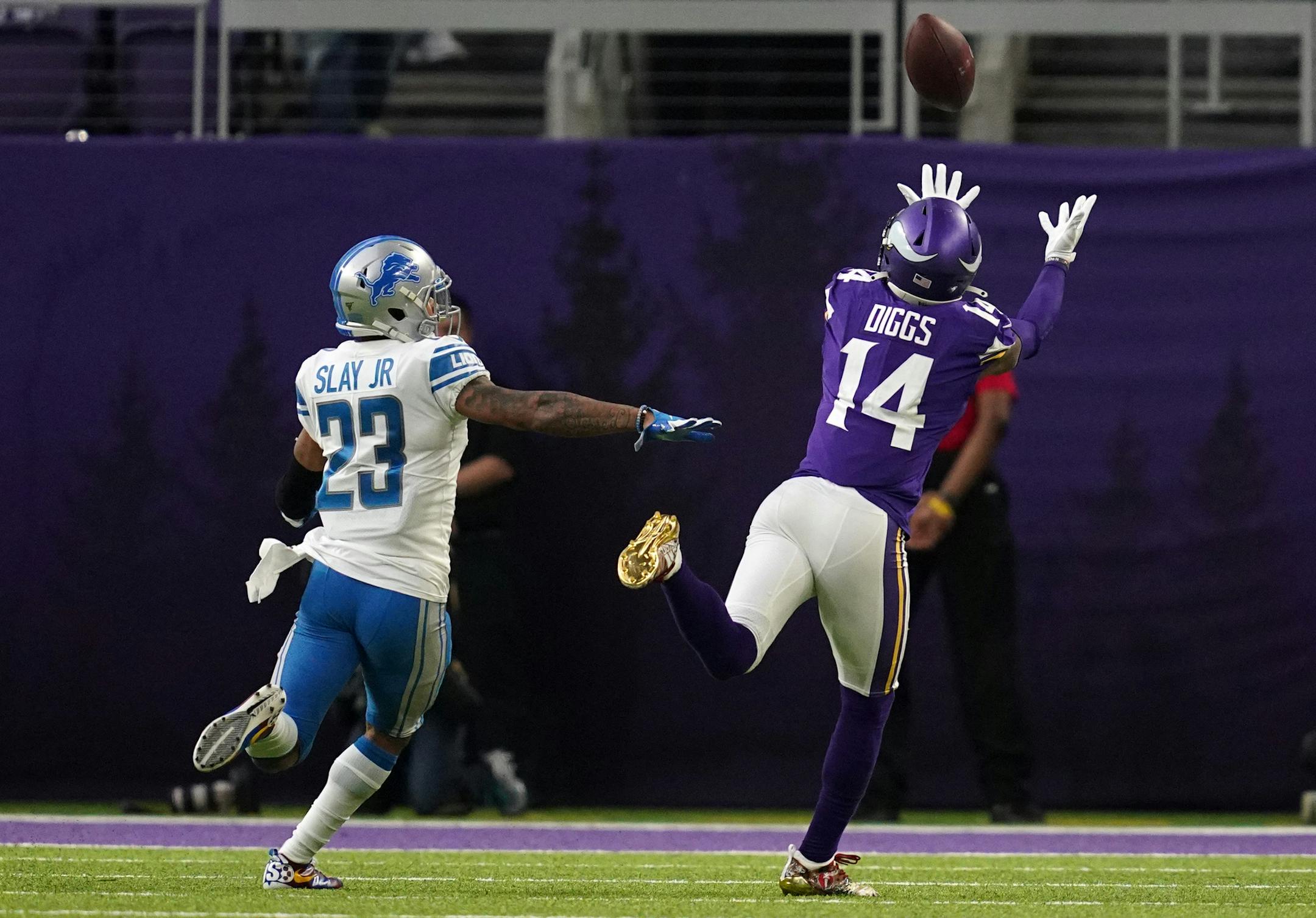 Minnesota Vikings wide receiver Stefon Diggs (14) caught a long pass from quarterback Kirk Cousins (8) over the head of Detroit Lions cornerback Darius Slay (23) to set the Vikings up for the touchdown in the second quarter. ] ANTHONY SOUFFLE &#x2022; anthony.souffle@startribune.com The Minnesota Vikings played the Detroit Lions in an NFL game Sunday, Dec. 8, 2019 at U.S. Bank Stadium in Minneapolis.