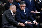 House Minority Leader Hakeen Jeffries, D-N.Y., left, and House Speaker Mike Johnson of La., confer during a ceremony at the U.S. Capitol on April 29, 