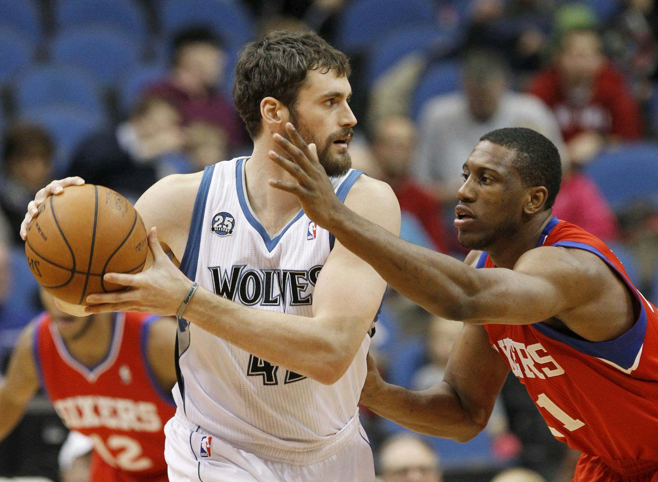 Forward Kevin Love, left, looks to drive against Philadelphia 76ers forward Thaddeus Young during the first quarter of an NBA basketball game in 2013. A source says Young will come to the Timberwolves as part of a three-team deal that sends Love to Cleveland.