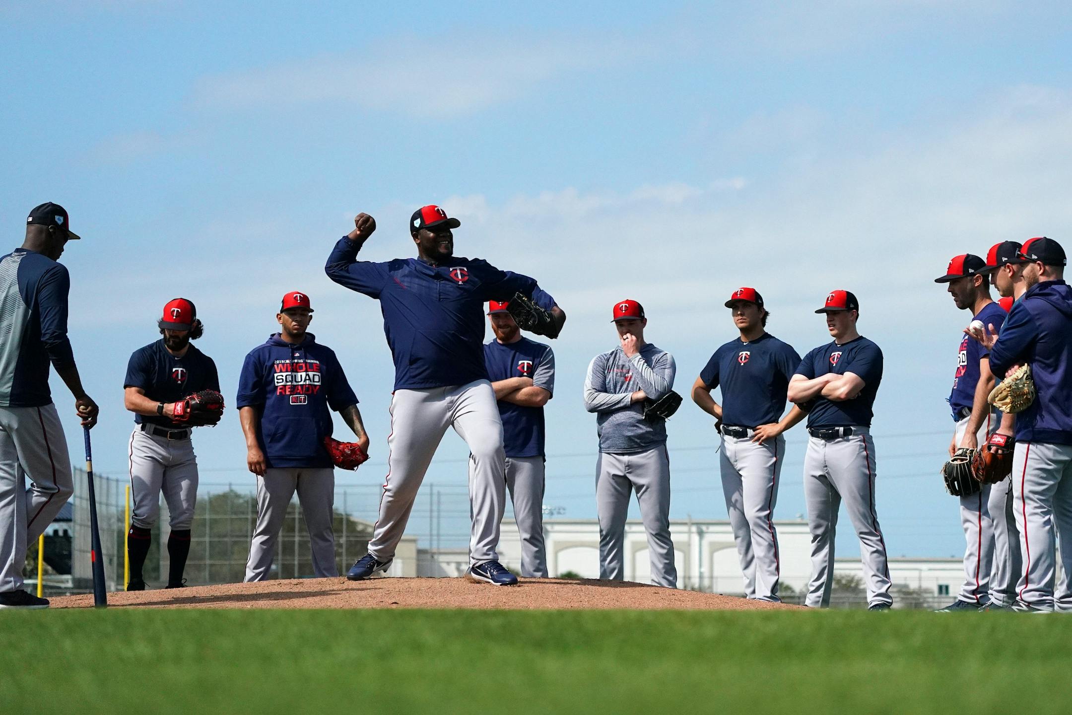 Twins pitcher Michael Pineda (35) showed how to check a runner at first during a drill on the practice field Saturday.