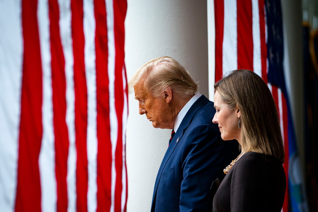 Then-President Donald Trump with Judge Amy Coney Barrett, his nominee to replace Justice Ruth Bader Ginsburg on the Supreme Court, in the Rose Garden of the White House in Washington, Sept. 26, 2020. 