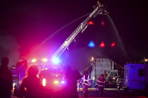 Firefighters battled a multiple-alarm industrial fire at a warehouse on Bass Lake Road on Tuesday, Dec. 1, 2020 in Maple Grove, Minn.
