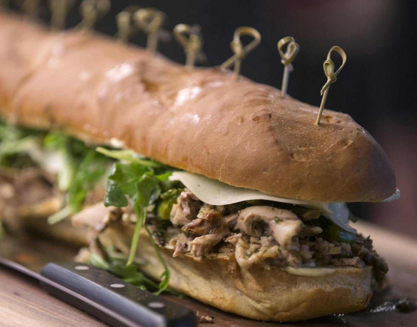 The Italian roast pork sandwich, part of the AZC Hoagies concept by chefs Gavin Kaysen and Andrew Zimmern. ] (Leila Navidi/Star Tribune) leila.navidi@startribune.com BACKGROUND INFORMATION: Officials with the Minnesota Vikings, the Minnesota Sports Facilities Authority and Aramark announce some of the local culinary partners that will be featured at U.S. Bank Stadium during a press conference on Tuesday, May 24, 2016.