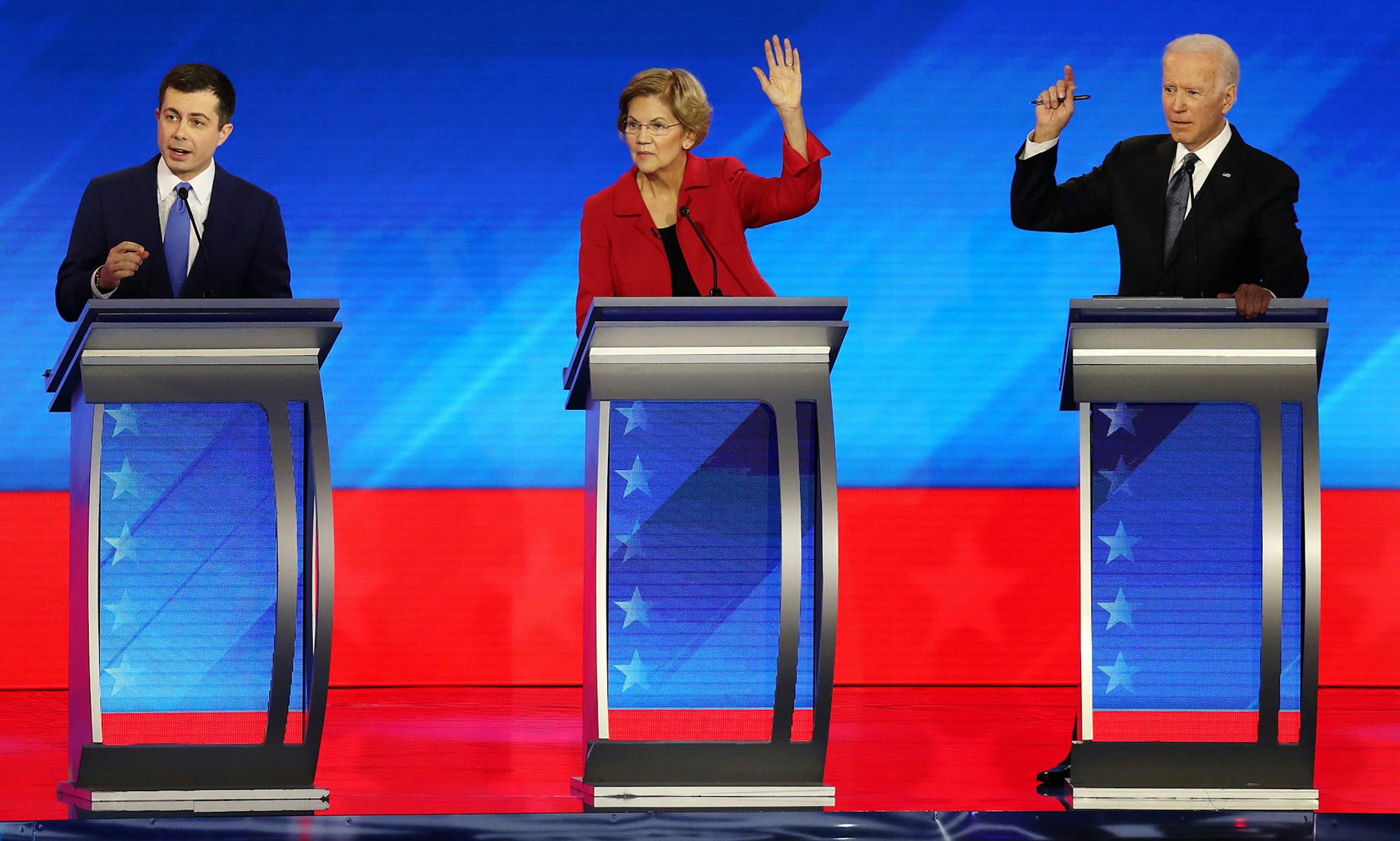 From left, Democratic presidential candidates former South Bend, Ind., Mayor Pete Buttigieg, Sen. Elizabeth Warren (D-Mass.) and former Vice President Joe Biden participate in the Democratic presidential primary debate in the Sullivan Arena at St. Anselm College in Manchester, N.H., on Friday, Feb. 7, 2020. (Joe Raedle/Getty Images/TNS) ORG XMIT: 1566895