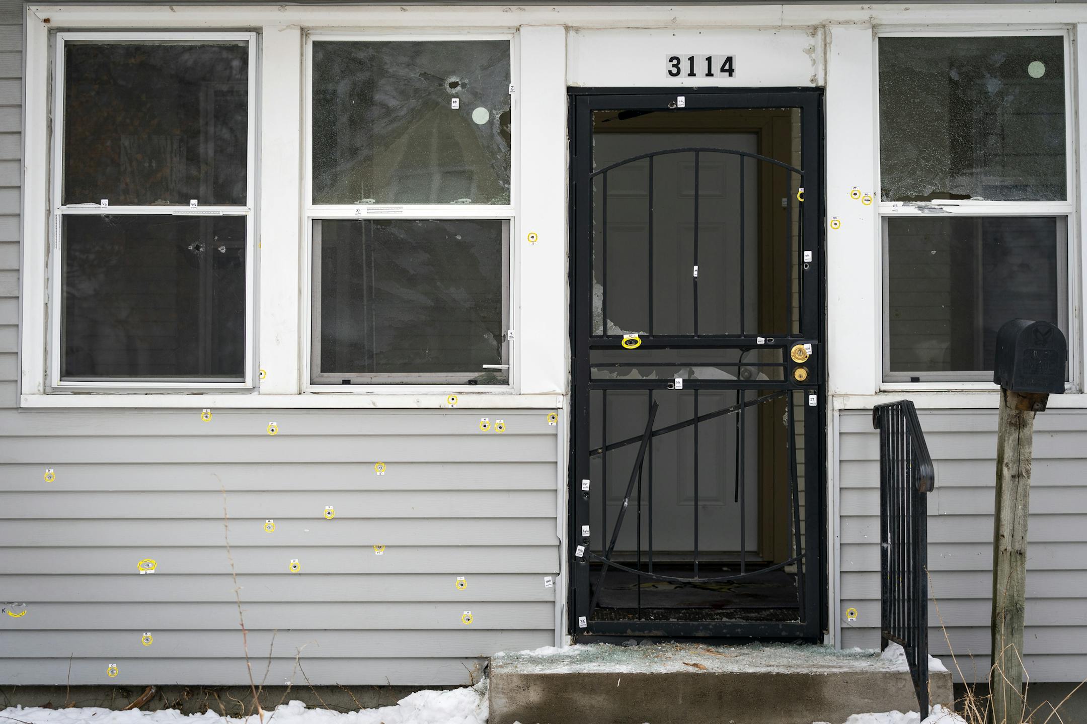 Bullet holes riddle the front of the house at 3114 N. Thomas Avenue in Minneapolis that was the scene of Sunday's police-involved shooting. ] LEILA NAVIDI • leila.navidi@startribune.com BACKGROUND INFORMATION: The home at 3114 N. Thomas Avenue in Minneapolis that was the scene of Sunday's police-involved shooting, in which nine officers are said to have fired their weapons after a man emerged from his home clutching a Soviet-designed assault rifle. Photographed on Tuesday, December 17, 20