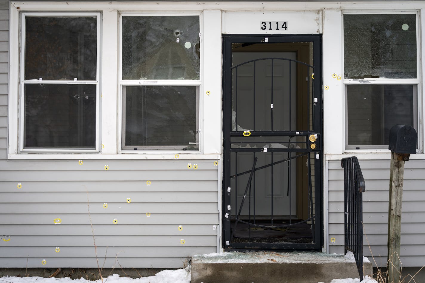 Bullet holes riddle the front of the house at 3114 N. Thomas Avenue in Minneapolis that was the scene of Sunday's police-involved shooting. ] LEILA NAVIDI &#x2022; leila.navidi@startribune.com BACKGROUND INFORMATION: The home at 3114 N. Thomas Avenue in Minneapolis that was the scene of Sunday's police-involved shooting, in which nine officers are said to have fired their weapons after a man emerged from his home clutching a Soviet-designed assault rifle. Photographed on Tuesday, December 17, 20