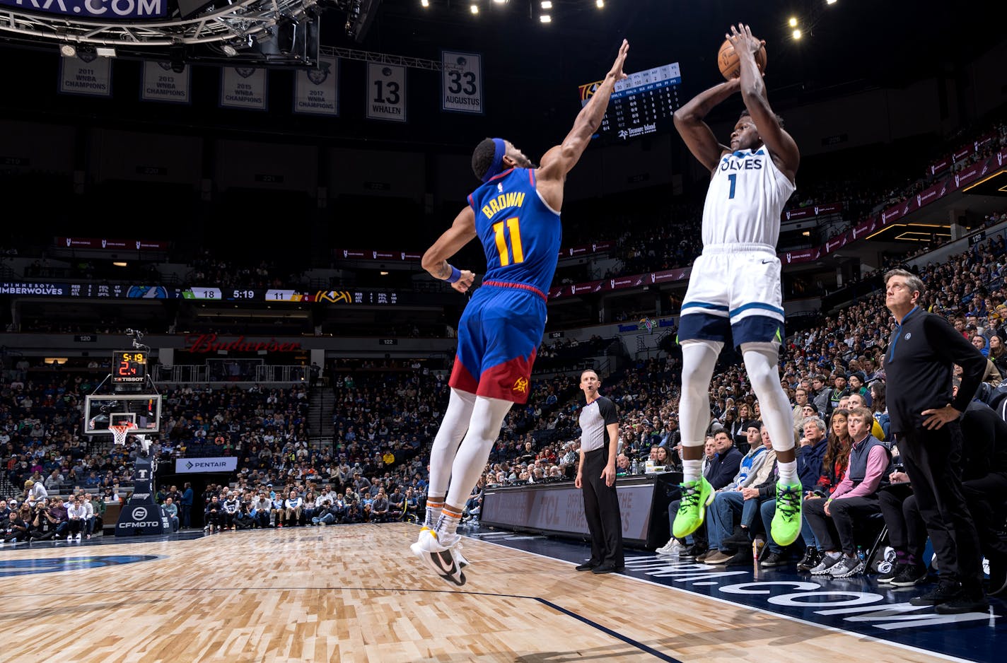 Anthony Edwards (1) of the Minnesota Timberwolves attempts a shot while defended by Bruce Brown (11) of the Denver Nuggets Monday, January 2, 2023, at Target Center in Minneapolis, Minn. ] CARLOS GONZALEZ • carlos.gonzalez@startribune.com.