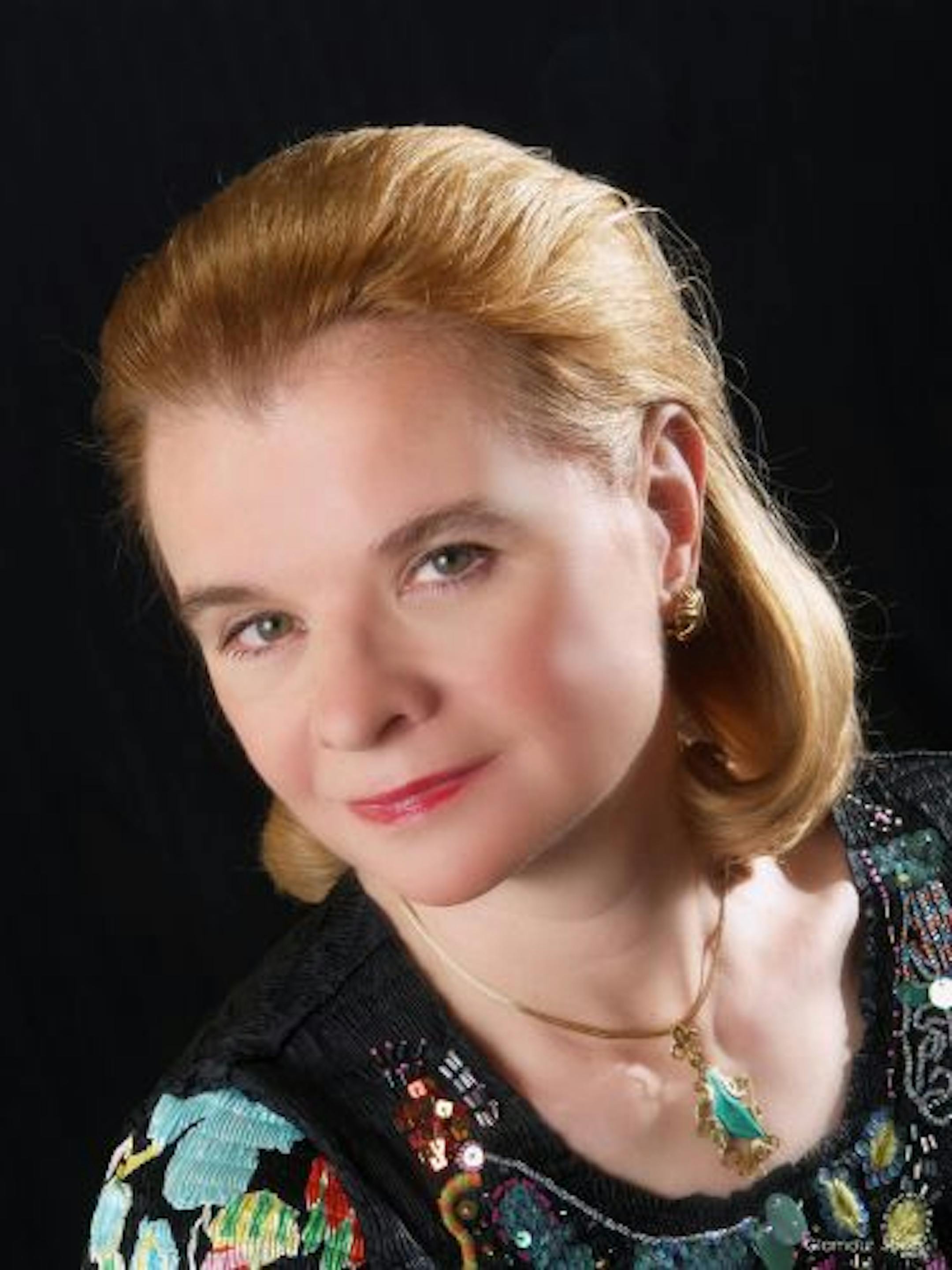 Pianist Lydia Artymiw performed with former student Andrew Staupe in Mozart's Concerto for Two Pianos.