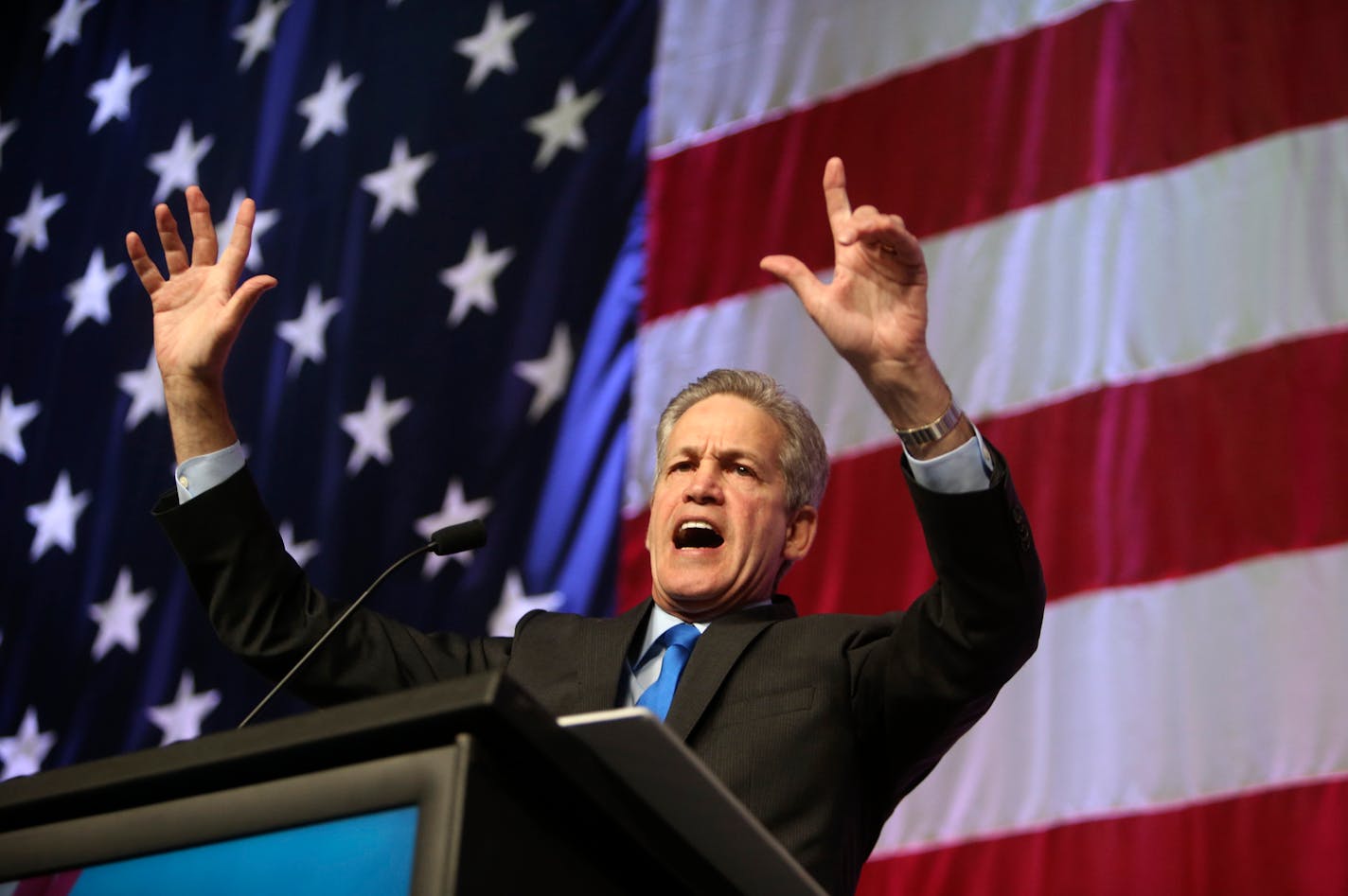 Former U.S. Sentator Norm Coleman stood at the podium and held up seven fingers, signifying the number of Minnesota House seats the Republicans need to win in the next election to take control of the House at the Minnesota State Legislature. Coleman spoke at the Minnesota Republican Party Convention at the Rochester Civic Center Friday, May 30, 2014.](DAVIDJOLES/STARTRIBUNE) djoles@startribune.com Minnesota Republican Party Convention at the Rochester Civic Center Friday, May 30, 2014