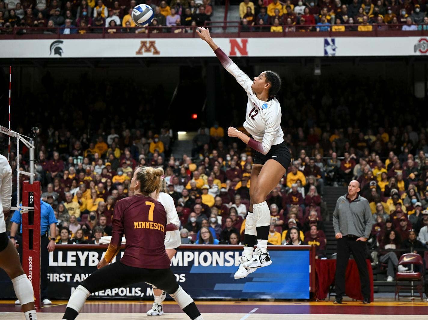 Minnesota Gophers outside hitter Taylor Landfair (12) leaps to hit the ball during the third set against Southeastern Louisiana in the first round of the NCAA Volleyball Tournament Friday, Dec. 2, 2022 at the University of Minnesota Athletic Pavilion in Minneapolis, Minn... ] AARON LAVINSKY • aaron.lavinsky@startribune.com