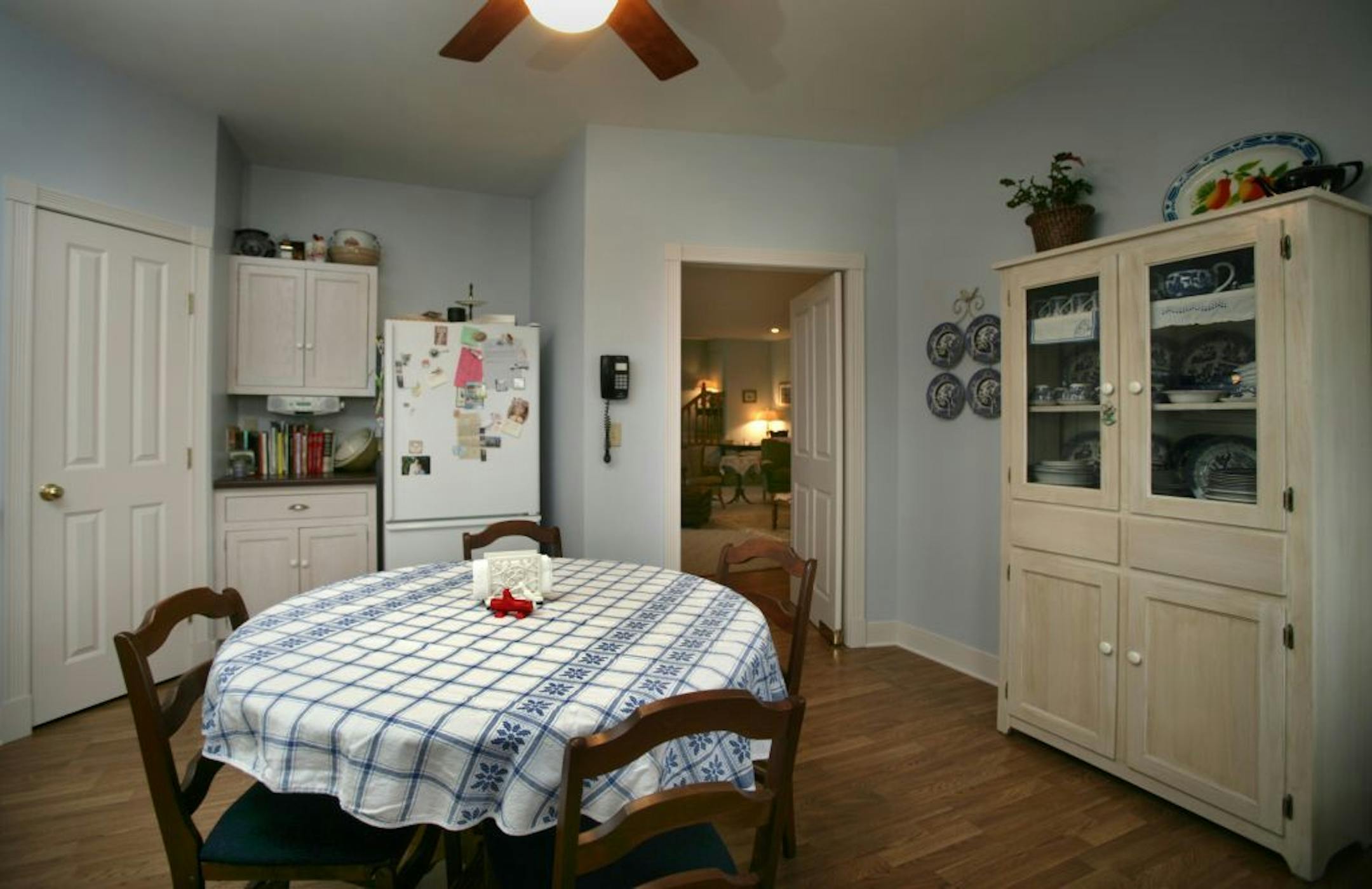 Joel Koyama�jkoyama@startribune.com Andy Griffith would feel right at home in Dave and Marsha Scheurman's home. The couple, such devoted fans of "The Andy Grifith Show" that they met in a fan-club chat room, have now built a faithful replica of Andy's house. Dave designed the exterior himself, and they've furnished the inside to match, down to the blue willow china and Grandma Moses paintings. The kitchen looking into the livingroom.