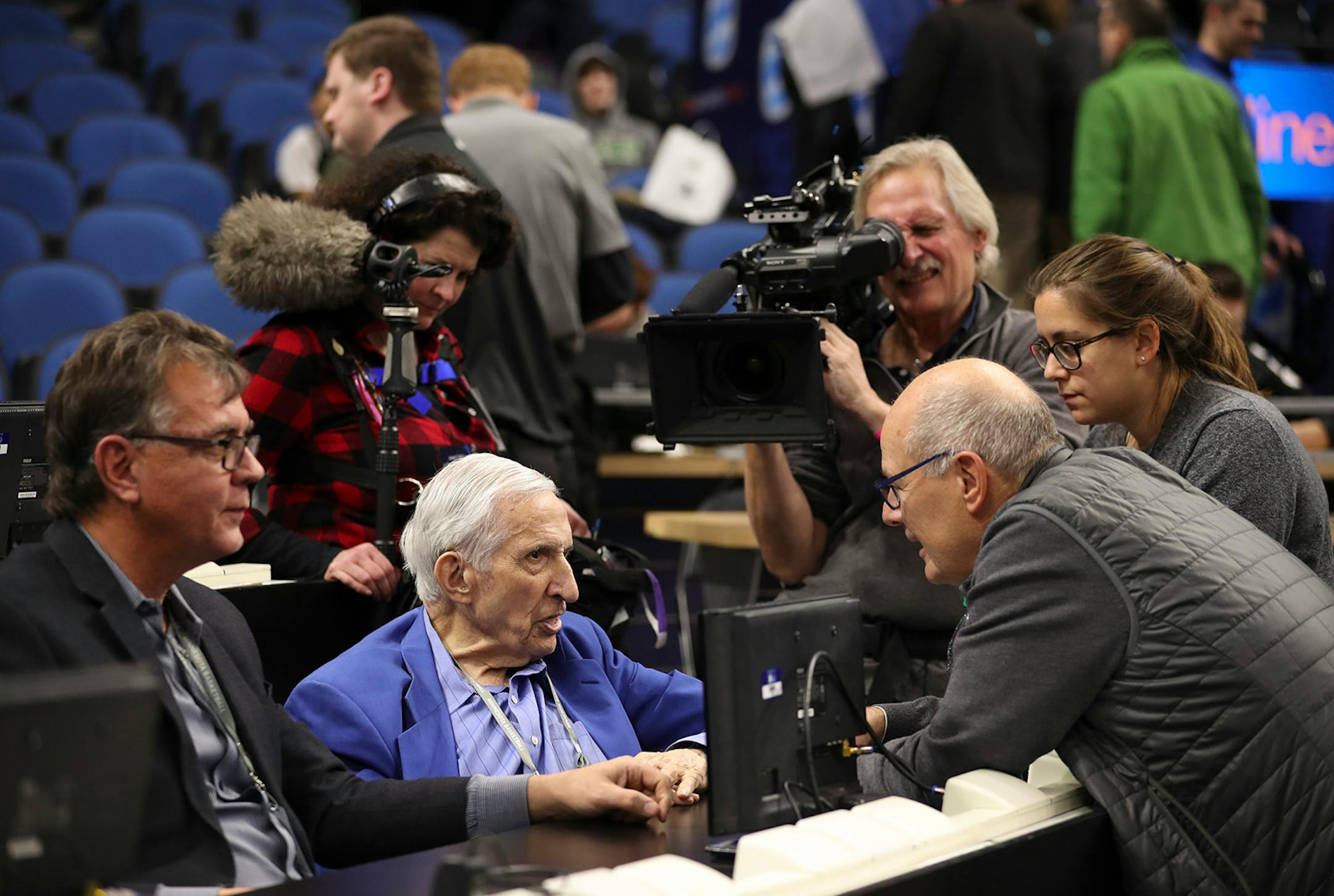Star Tribune columnist Sid Hartman, seated, is interviewed by Today Show correspondent Harry Smith, right, before a Timberwolves game in February, 2017.