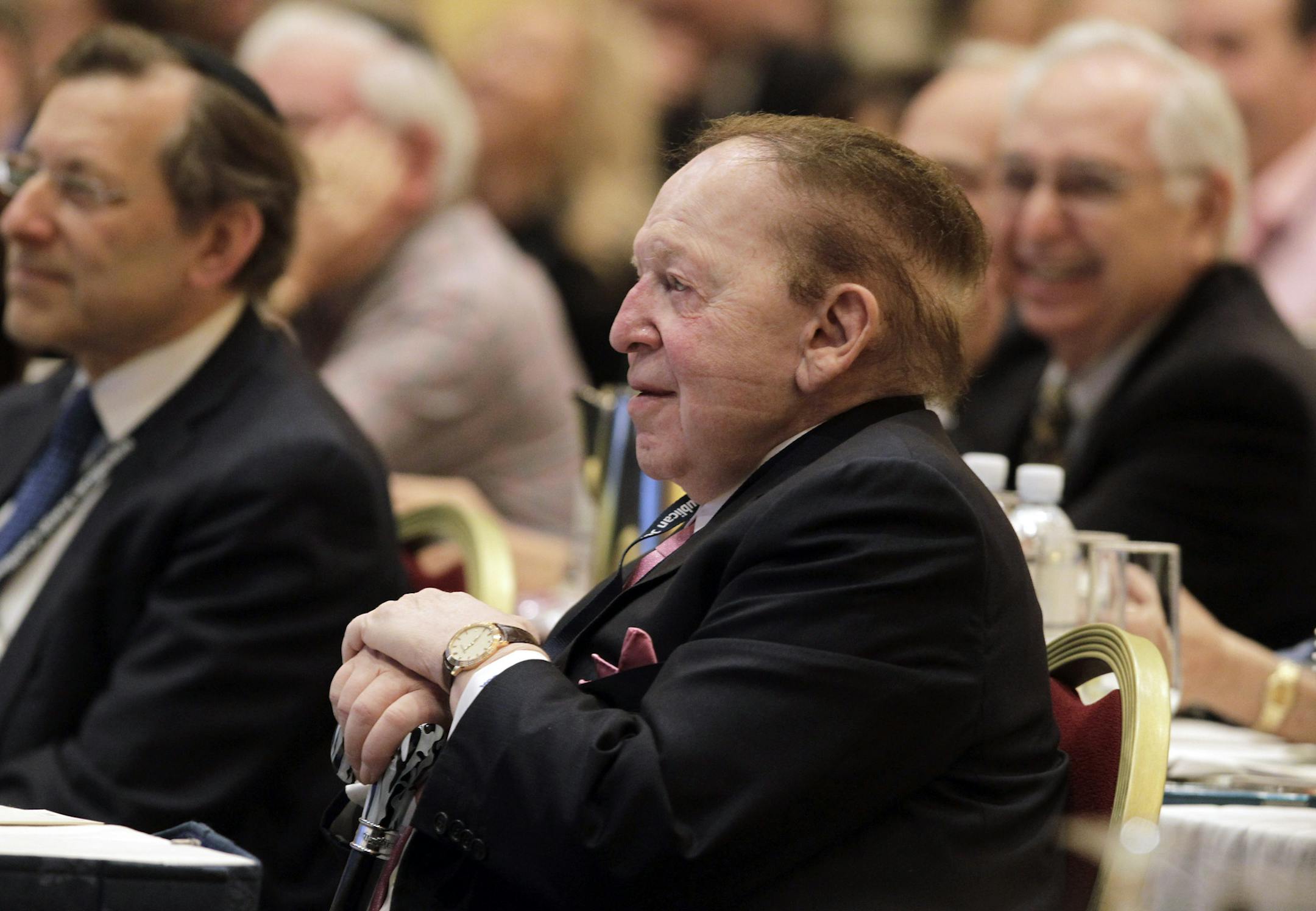 Sheldon Adelson listens to Gov. Chris Christie of New Jersey address a meeting of the Republican Jewish Coalition in Las Vegas, March 29, 2014. Adelson, a casino magnate who has become both the most coveted and feared big donor in the Republican party, loomed large over the weekend, and evens owns the hotel where the event was held. (John Gurzinski/The New York Times)