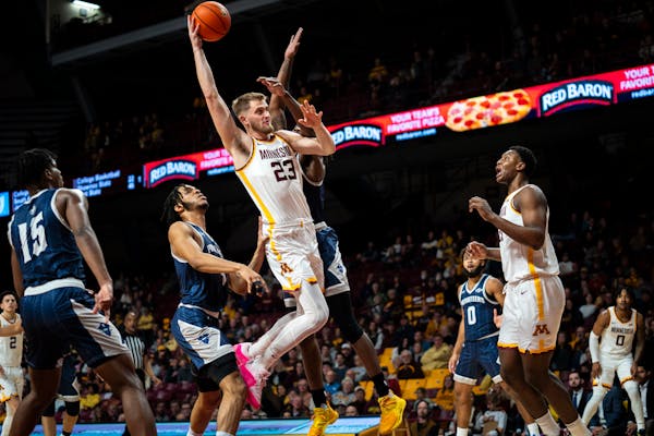 Gophers forward Parker Fox (23) took off for a dunk against New Orleans on Thursday night at Williams Arena.