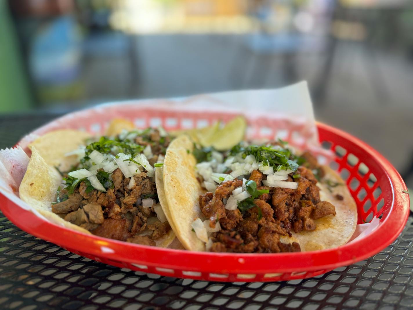 Two small corn tacos served in a red basket at Taqueria El Patron on Xerxes Avenue near 50th Street in south Minneapolis.