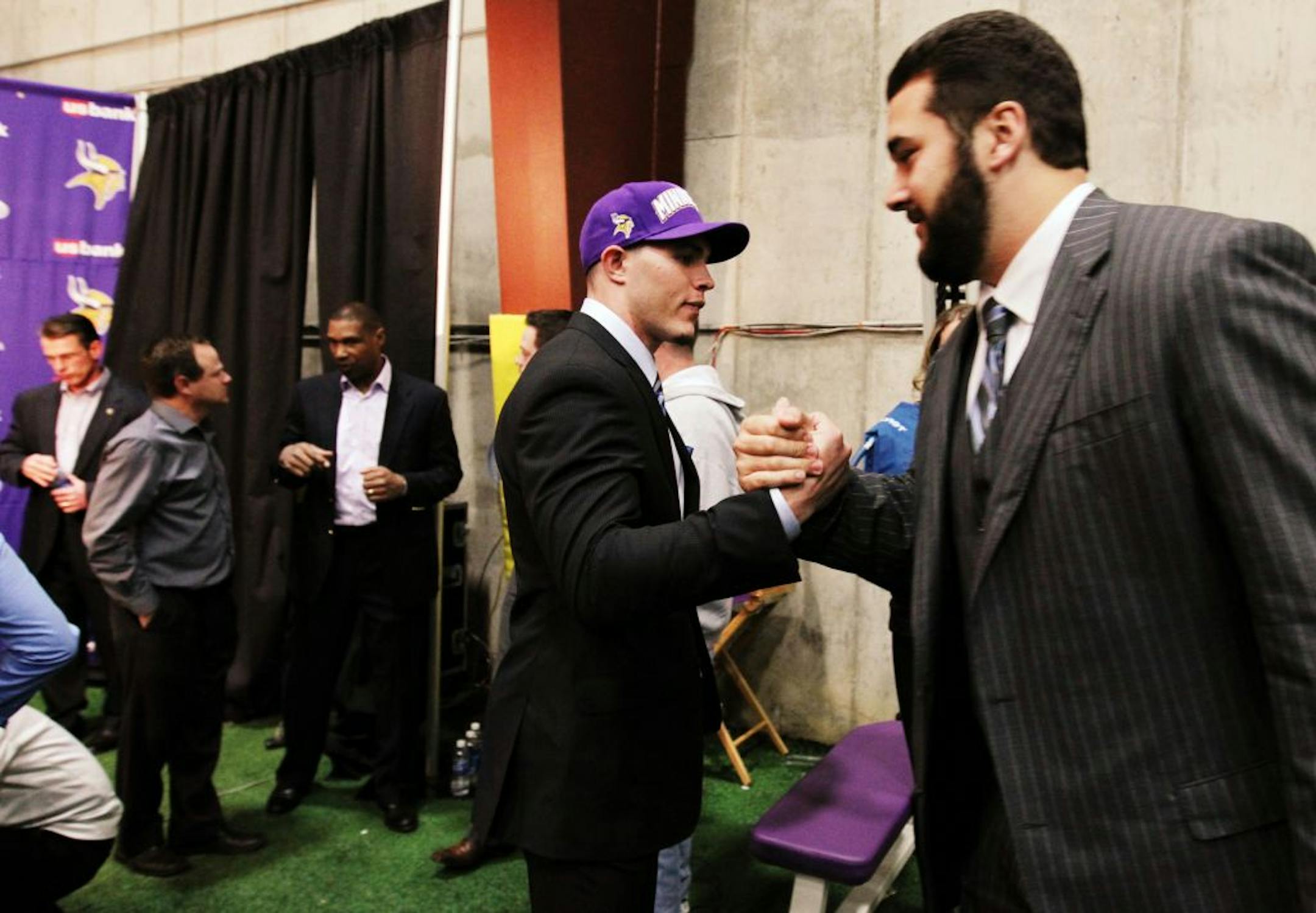 Minnesota Vikings first round draft picks Matt Kalil, right, and Harrison Smith congratulated each other after a press conference at Winter Park, the team's practice facility, in Eden Prairie, Friday, April 27, 2012.