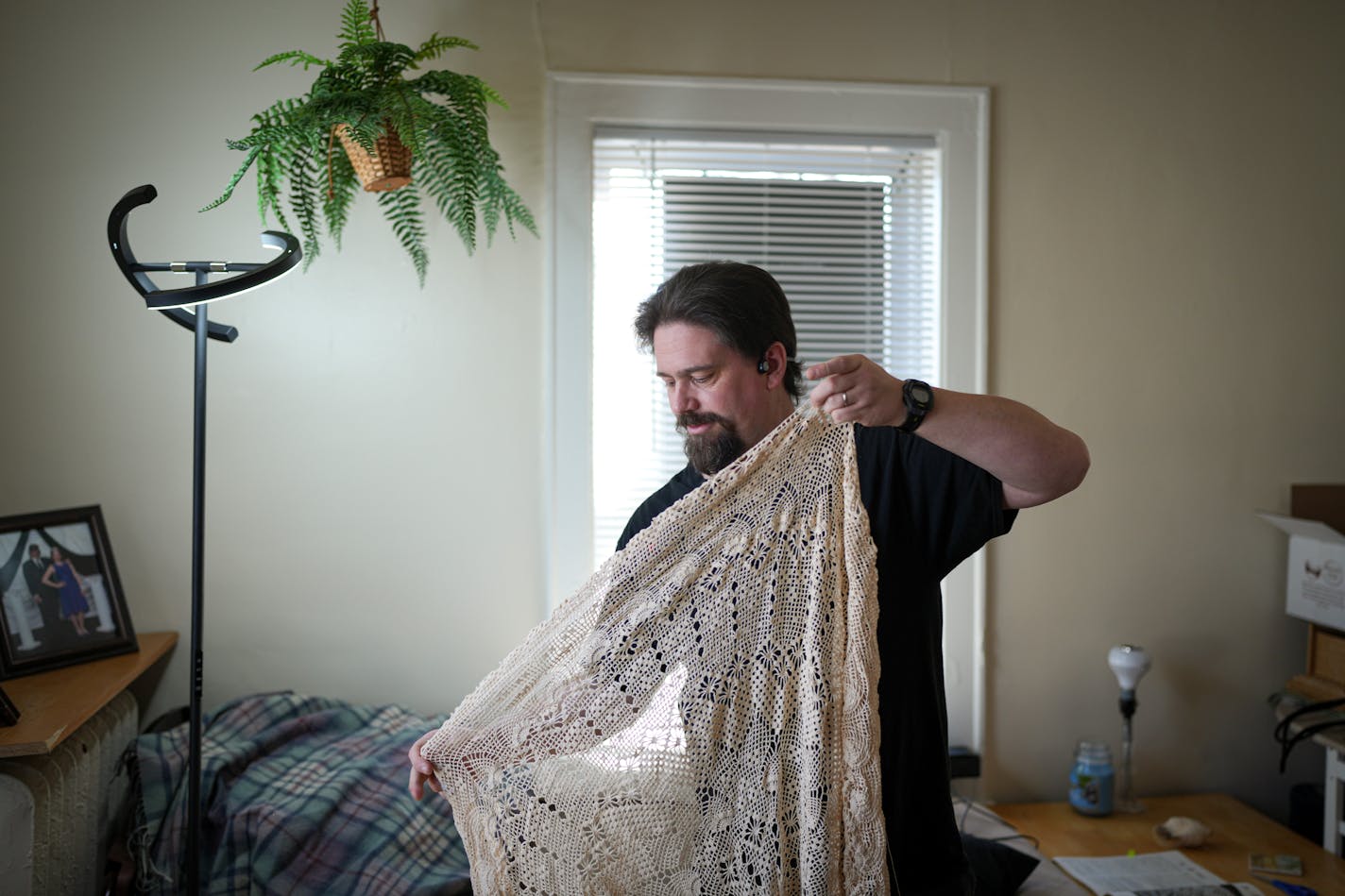 Brandon Buchanan holds the crochet project that a stranger's grandma left incomplete when she died.