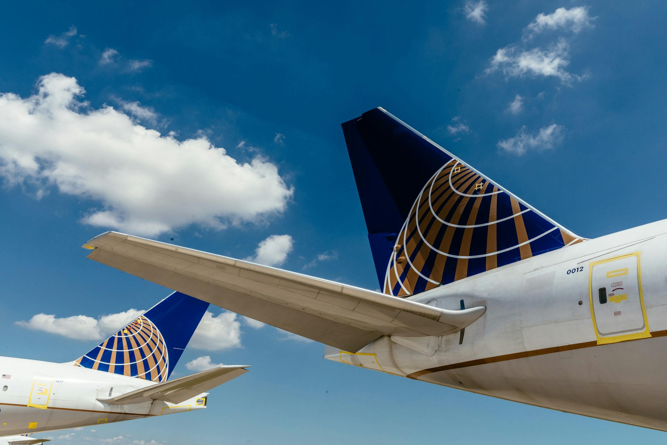 FILE - United Airline planes in storage during the coronavirus pandemic at the OÕHare Airport in Chicago, Aug. 7, 2020. When the coronavirus pandemic wiped out travel in the spring, United Airlines slashed its flight schedule, salted away aircraft in the New Mexico desert and parked planes at hangars around the country. (Lucy Hewett/The New York Times)