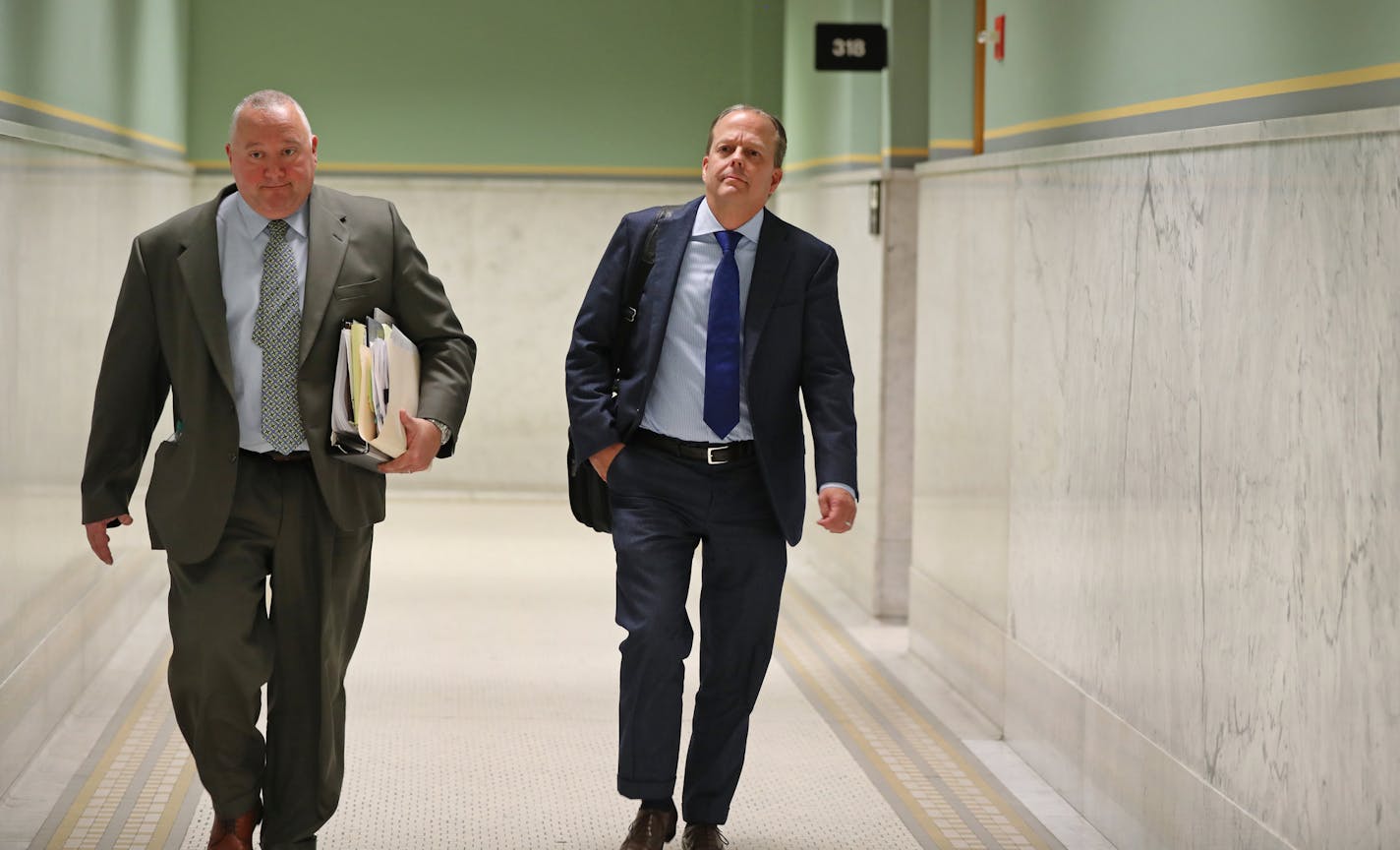 Stephen Frenz and attorney Douglas Turner walked through City Hall in Minneapolis.