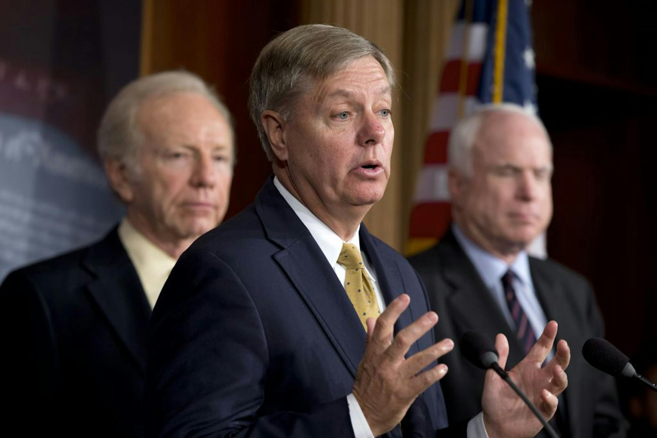 Sen. Lindsey Graham, R-S.C., center