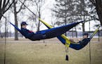 From left to right; Henry Bitter, 15 and Thor Holien, 15, chatted while hanging in their hammocks they hung at the rose garden at Lake Harriet on they