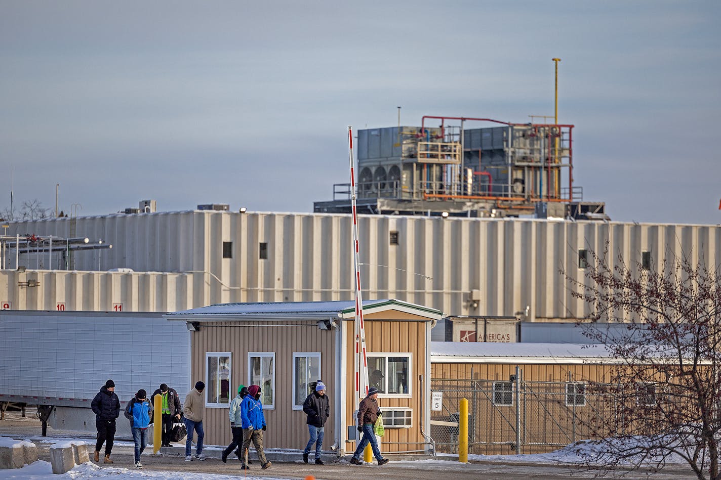 Workers make their way out of the Long Prairie Packing Company in Long Prairie, Minn., on Tuesday, Jan. 16, 2024. ] Elizabeth Flores • liz.flores@startribune.com