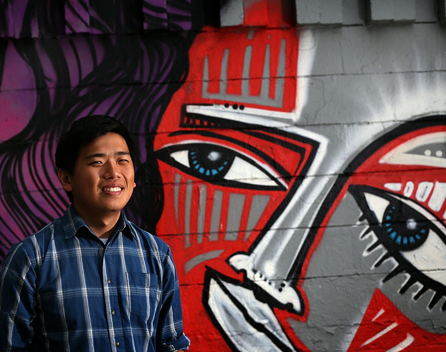 Poet Kevin Yang works with young artists at Intermedia Arts in Minneapolis. "The generation before us were explorers," he said. "We are creators." With the spoken word crucial to his art, he has learned to speak Hmong, but his younger siblings cannot.