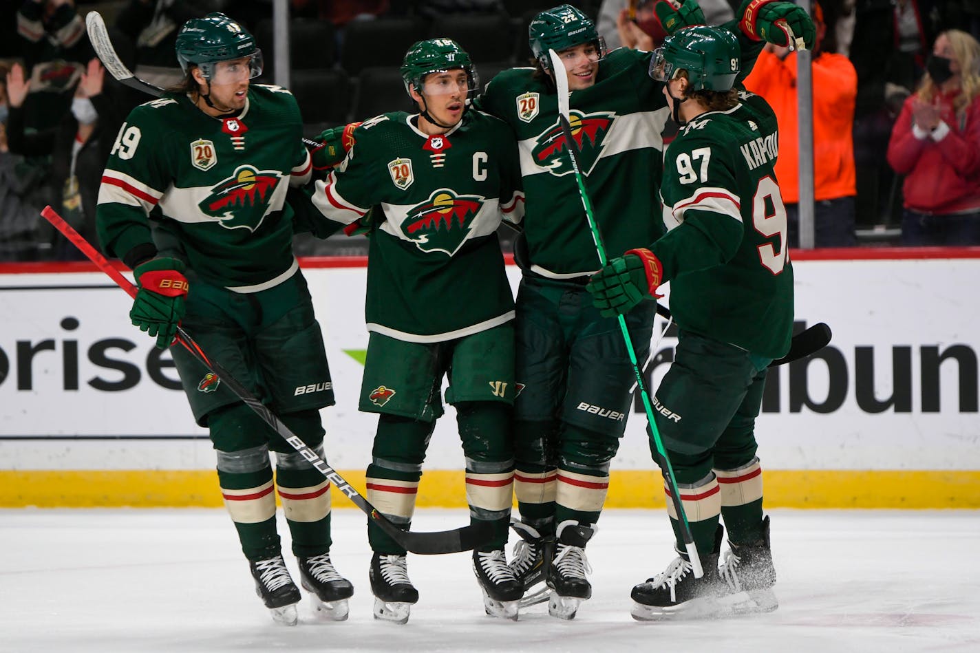 Minnesota Wild center Victor Rask, defenseman Jared Spurgeon, left wing Kevin Fiala&nbsp;and left wing Kirill Kaprizov, from left, celebrate after Spurgeon scored a goal against the Anaheim Ducks with an assist from Kaprizov during the first period of an NHL hockey game Saturday, May 8, 2021, in St. Paul, Minn. (AP Photo/Craig Lassig)