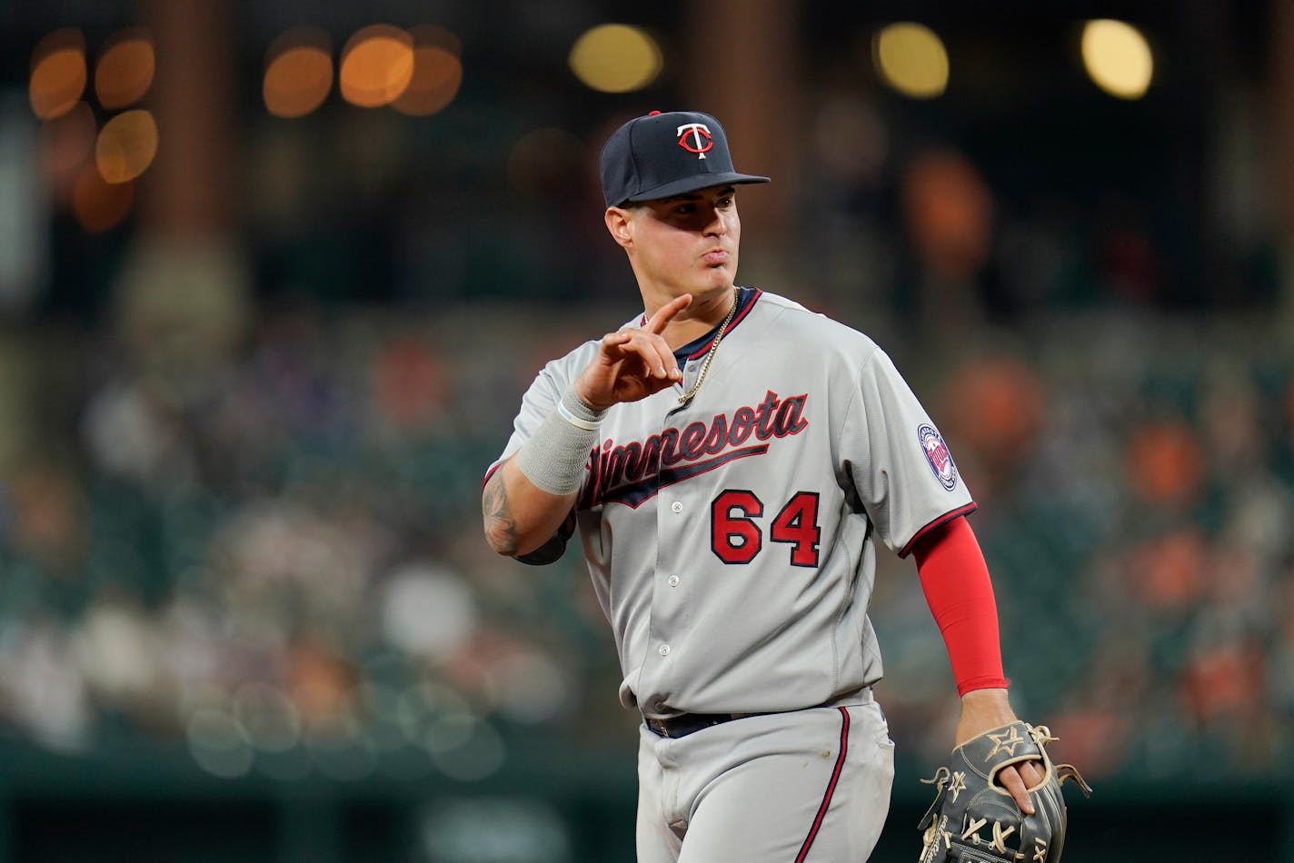 Minnesota Twins third baseman Jose Miranda gestures during the fourth inning of a baseball game against the Baltimore Orioles, Monday, May 2, 2022, in Baltimore. (AP Photo/Julio Cortez)