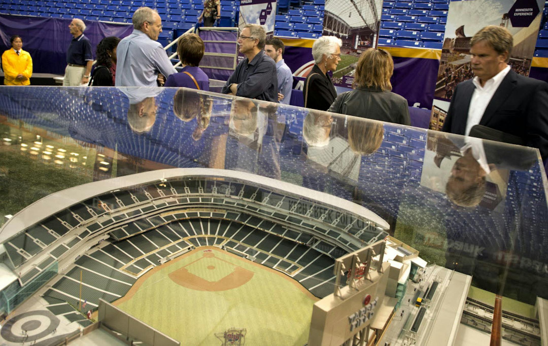 The five architectural firms bidding to win the design job for the new Vikings stadium showed some of their past projects in the Metrodome on Thursday.
