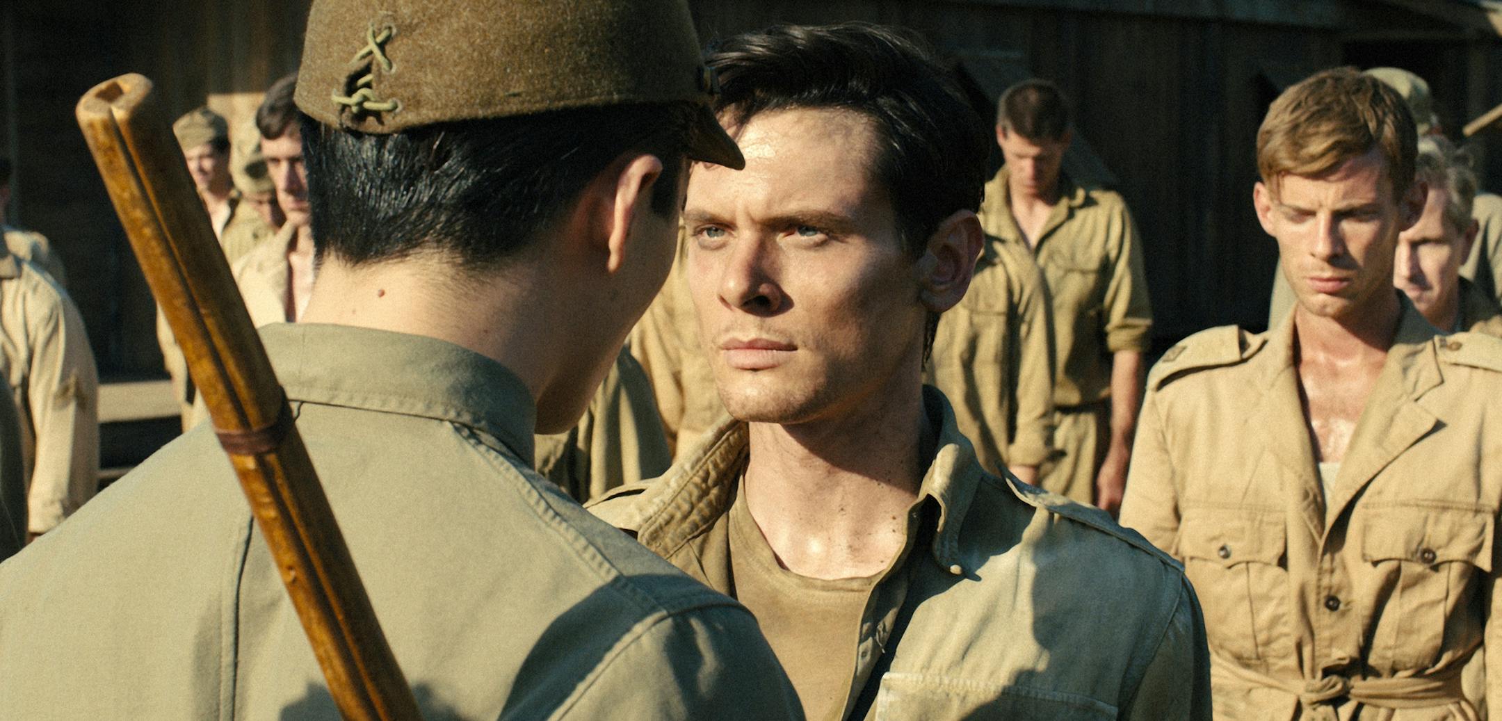 In this image released by Universal Pictures, Jack O'Connell portrays Olympian and war hero Louis "Louie" Zamperini in a scene from "Unbroken." The film, directed by Angelina Jolie, did not receive any Golden Globe nominations on Thursday. (AP Photo/Universal Pictures)