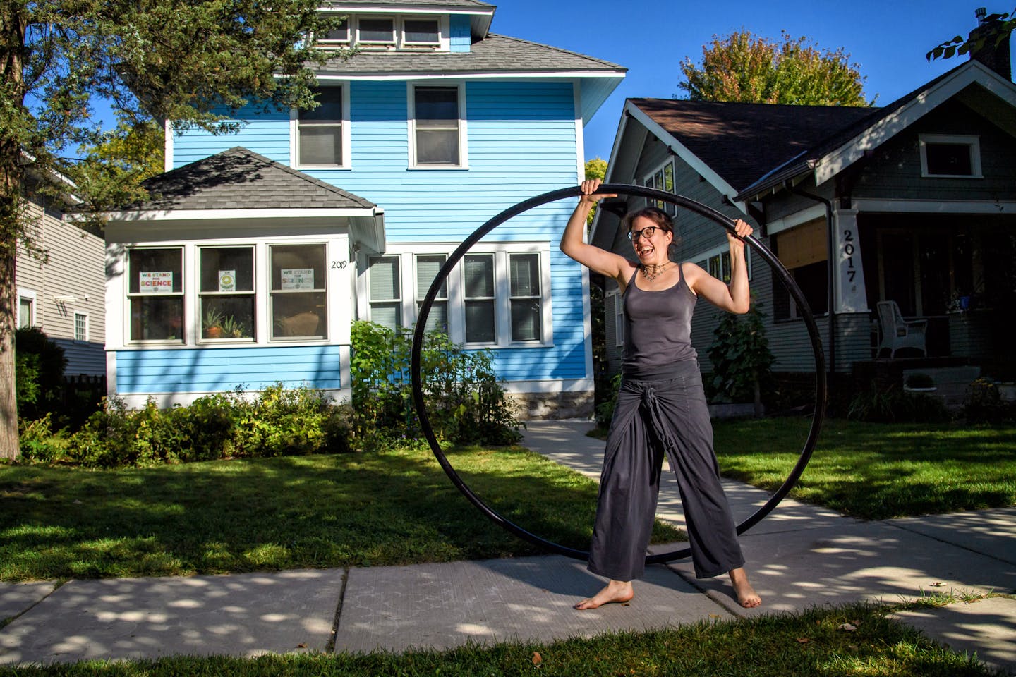 University of St. Thomas engineering Prof. AnnMarie Thomas worked out on her Cyr wheel in front of her St. Paul home.