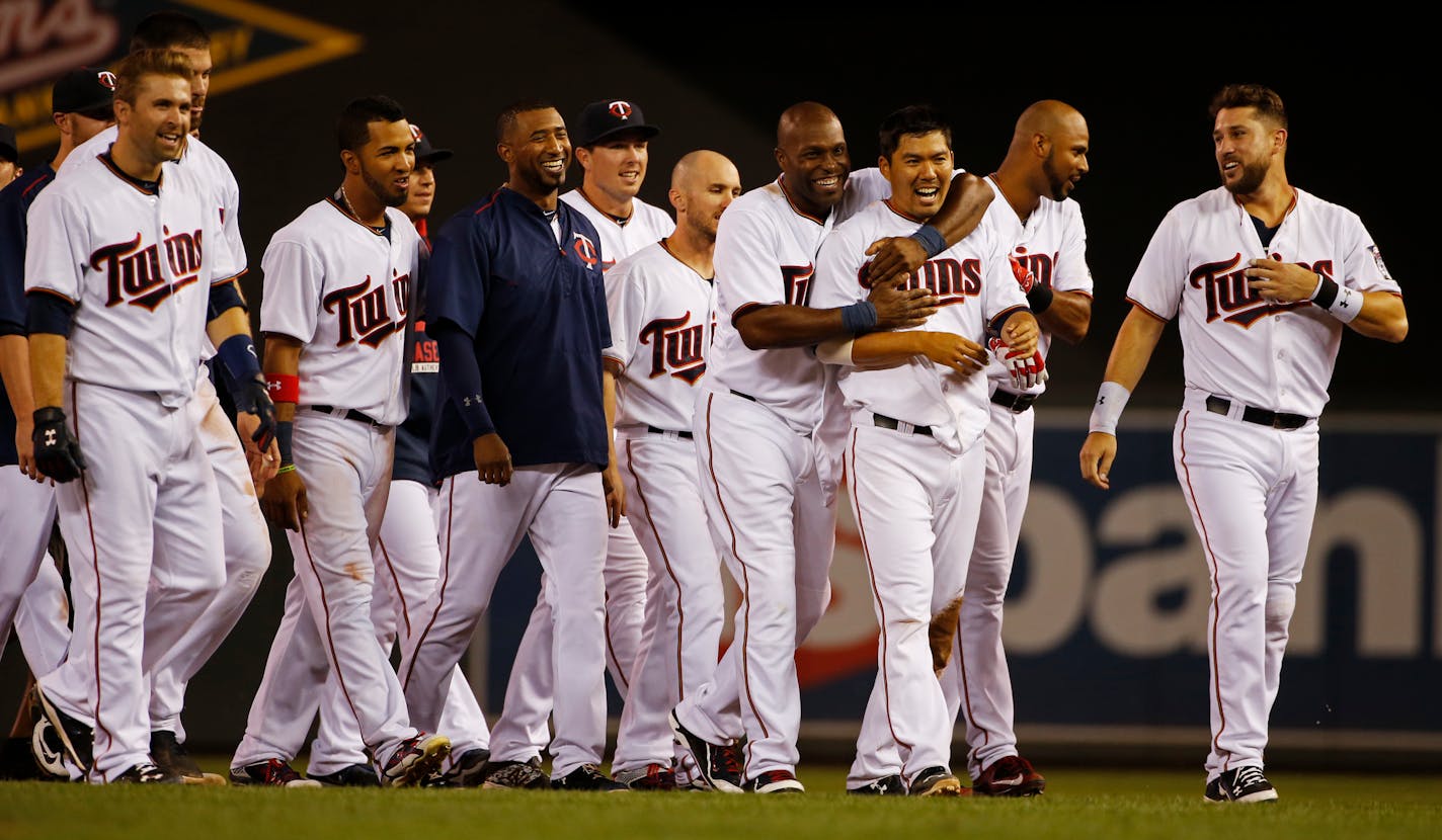 The Twins celebrate Eduardo Escobar's walk-off double that scored Kurt Suzuki for the 3-2 win.