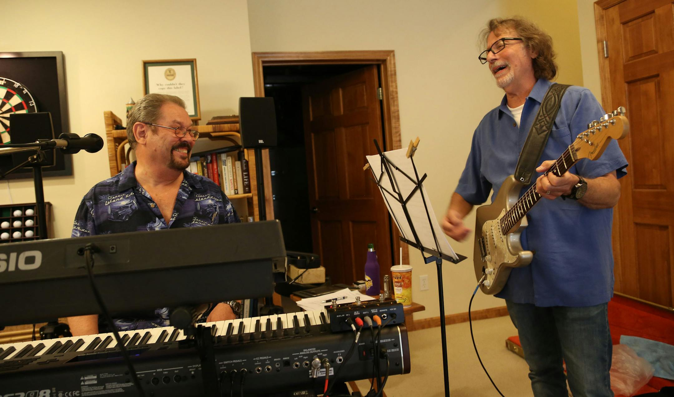 Guitar player Owen Husney laughed at his own bad jokes with Jay Luttio and the rest of the band as they get ready for the reunion performance. ] (KYNDELL HARKNESS/STAR TRIBUNE) kyndell.harkness@startribune.com High Spirits during rehearsal in Chanhassen, Min., Tuesday August 26, 2015.