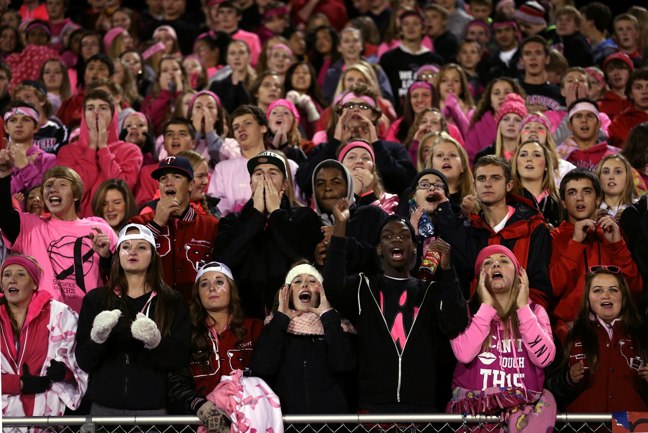 The student section cheers during a Shakopee High School home football game in Shakopee, Minn. ] LEILA NAVIDI leila.navidi@startribune.com / BACKGROUND INFORMATION: Friday, October 10, 2014. Shakopee, the suburban leader in adding affordable housing, is now letting all K-12 students into any event, including plays and concerts, for free in an effort to make all aspects of school more accessible.
