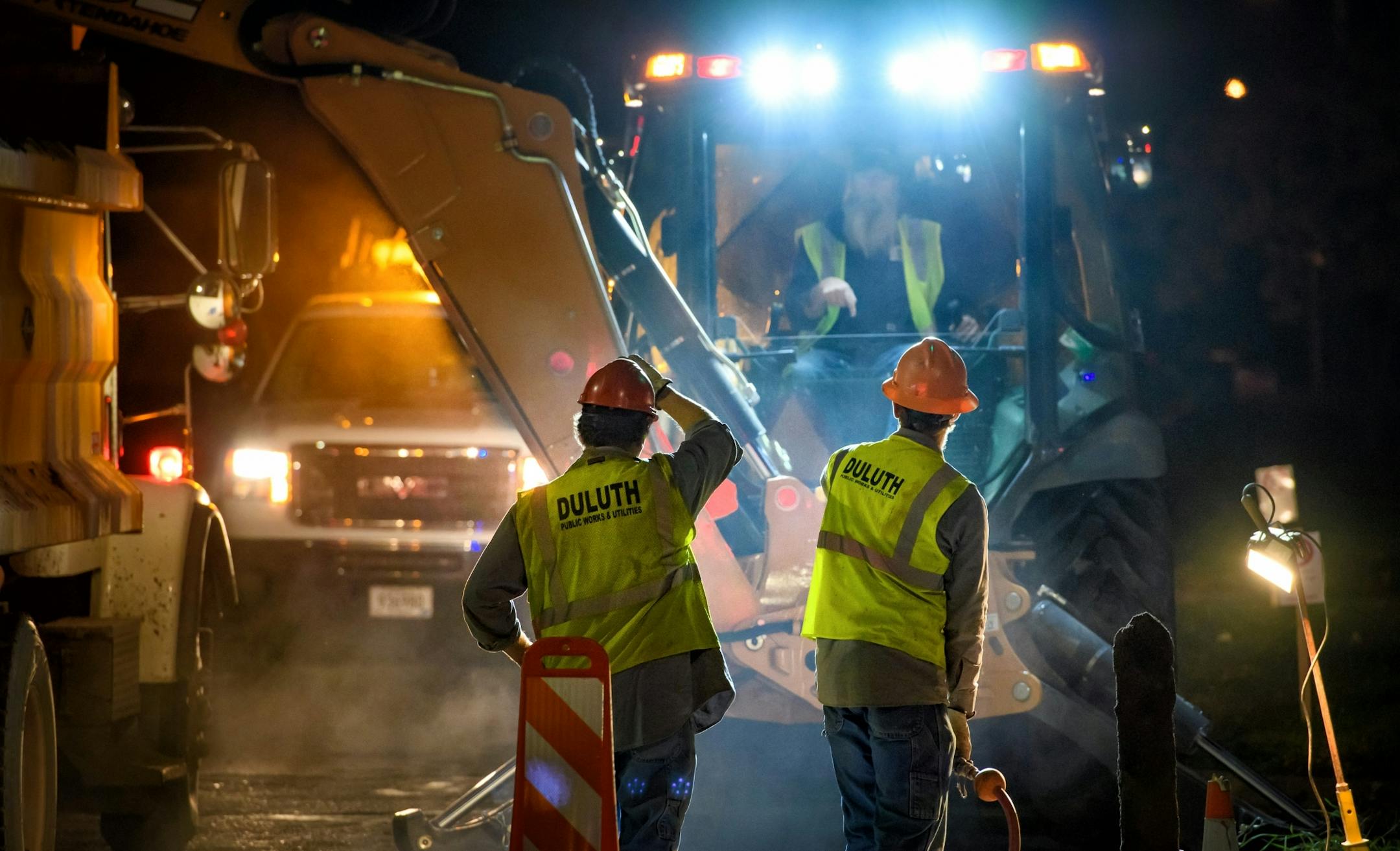 Workers from Duluth Public Works and Utilities Department replace a broken water main valve at Grand Avenue and 40th Ave West. Work was done overnight to avoid disrupting traffic during the day.